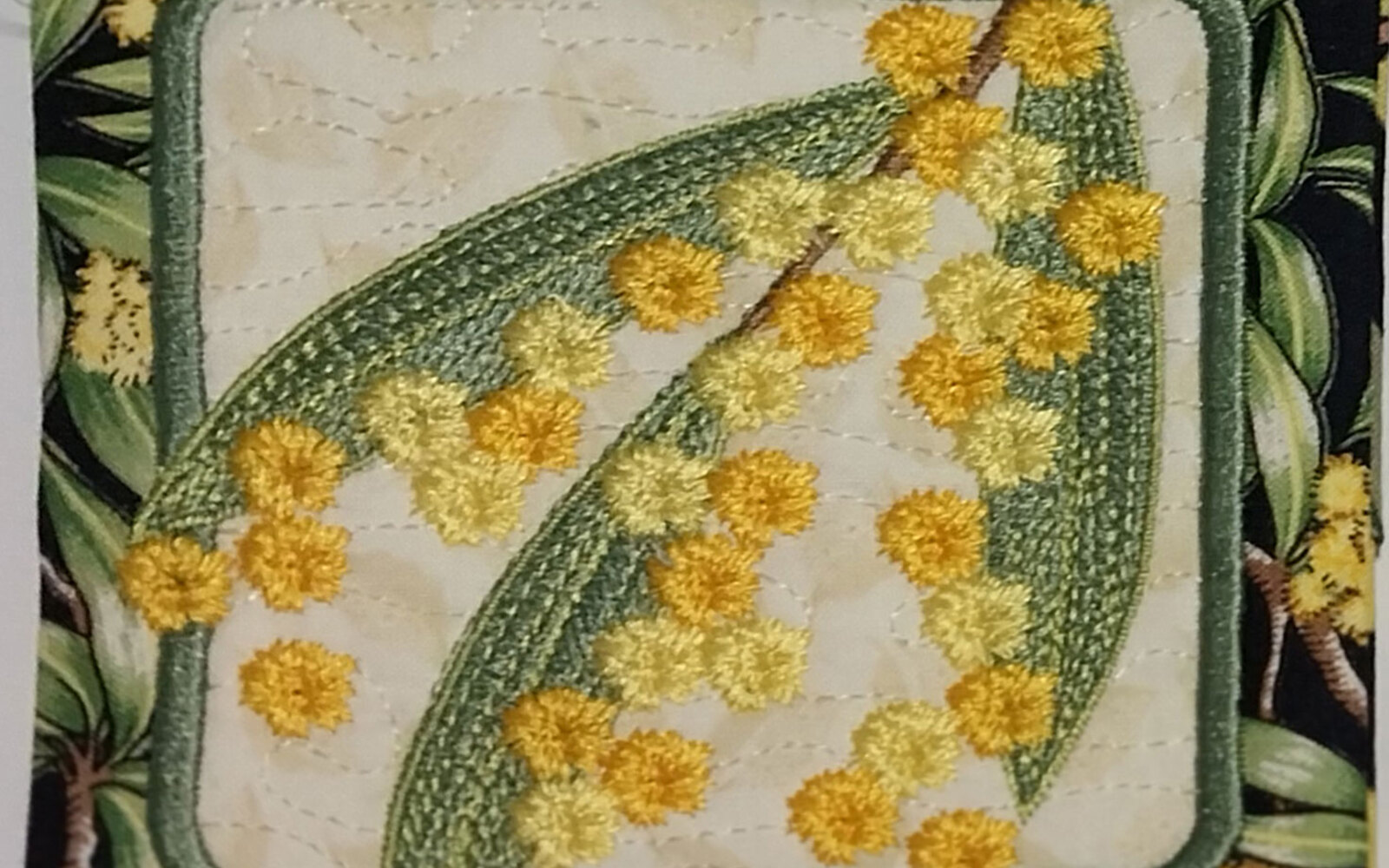 Wattle blossom embroidered coaster in yellow and green