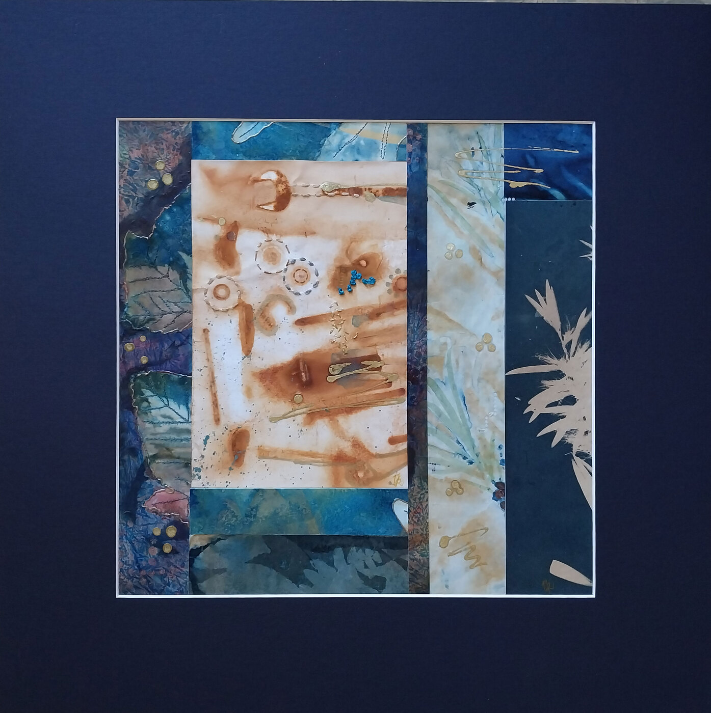 Framed contemporary textile collage with rust prints and cyanotypes